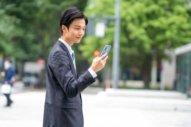 istock Businessman making a phone call in the business district 1449201879