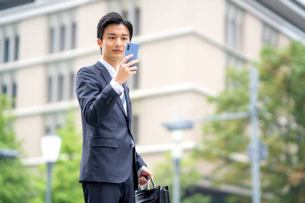 istock Businessman making a phone call in the business district 1449202351