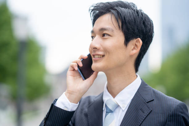 istock Businessman making a phone call in the business district 1449202388