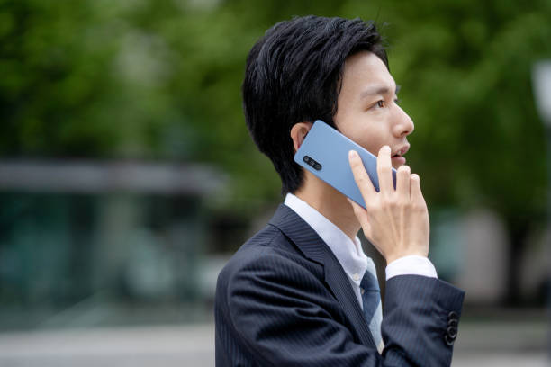 istock Businessman making a phone call in the business district 1449202425