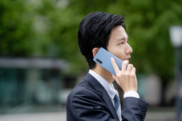 istock Businessman making a phone call in the business district 1449202469