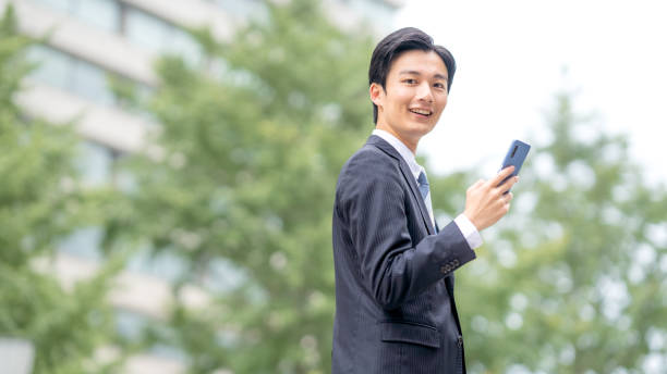 istock Businessman making a phone call in the business district 1449202554