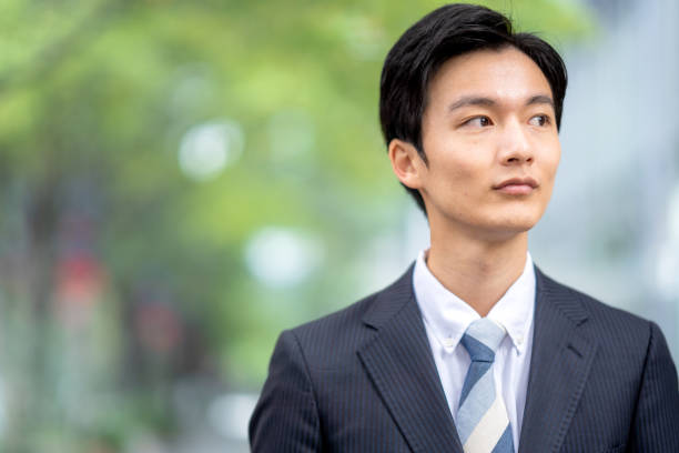 istock A man in a suit walking in the business district 1449204053