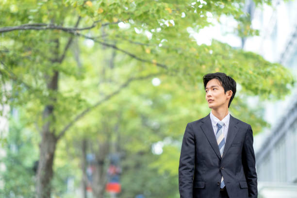 istock A man in a suit walking in the business district 1449204055