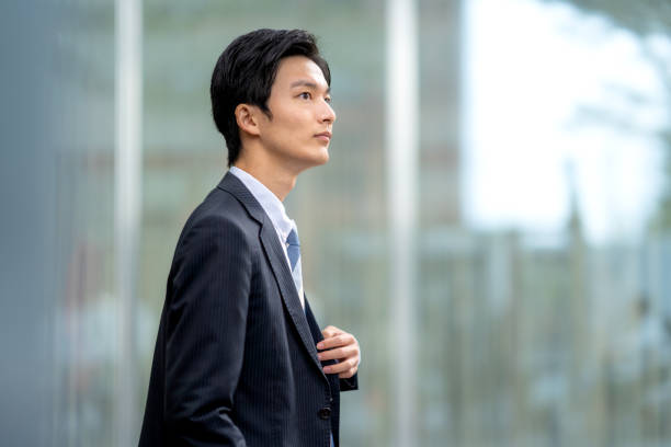 istock A man in a suit walking in the business district 1449204169