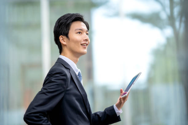 istock A man in a suit walking in the business district 1449204208