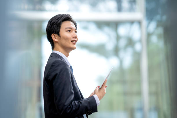 istock A man in a suit walking in the business district 1449204266