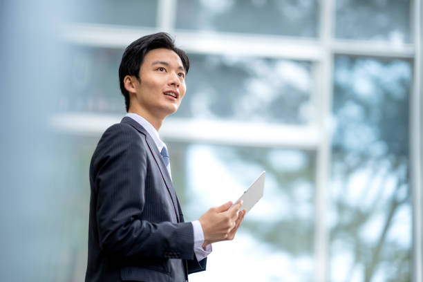 istock A man in a suit walking in the business district 1449204272