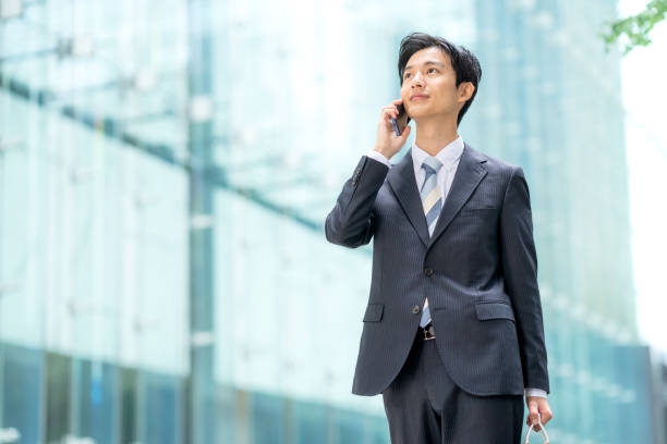 istock Businessman making a phone call in the business district 1449205031