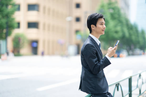 istock Businessman making a phone call in the business district 1449205164