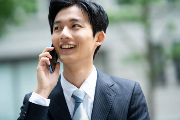 istock Businessman making a phone call in the business district 1449205175