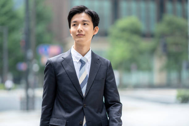 istock A man in a suit walking in the business district 1449205206