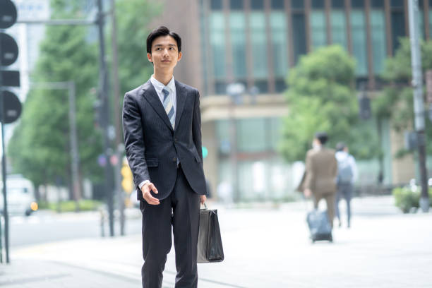 istock A man in a suit walking in the business district 1449205243