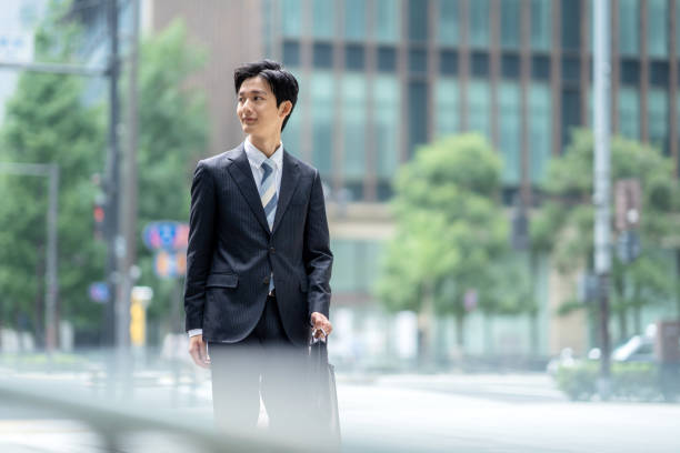 istock A man in a suit walking in the business district 1449205245