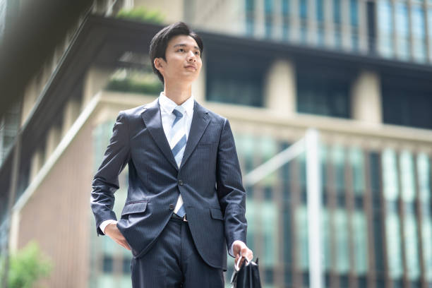 istock A man in a suit walking in the business district 1449205298