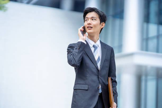 istock Businessman making a phone call in the business district 1449206815