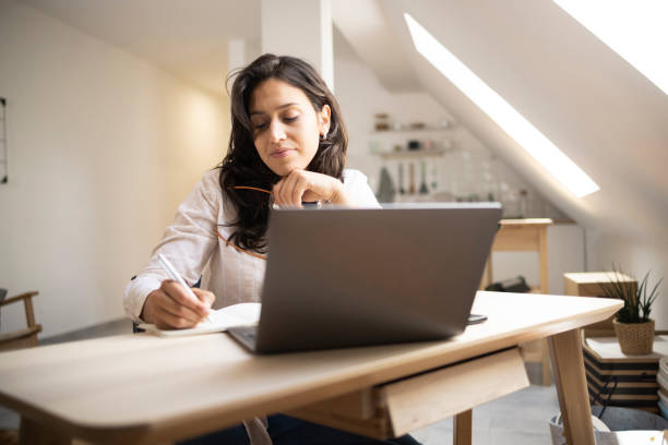 istock Happy young woman working online and enjoying 1449207514