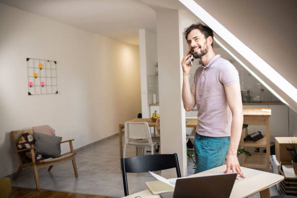 istock Young freelancer working at his home office 1449207560