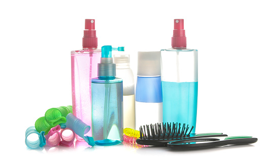 Various hair care products and various hair accessories on a white isolated background. hair cosmetics