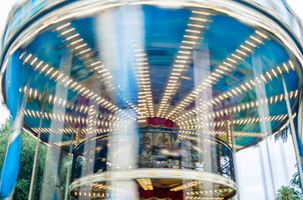 Carousel at night with blurred lighting.  Background concept - Abstract concept for winter fun