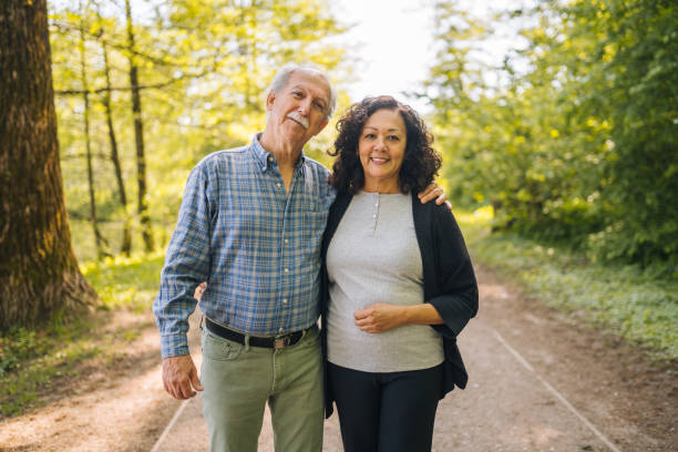 istock Mixed Senior Couple Posing for a Picture in a Park 1449210919