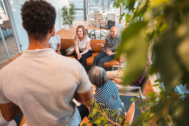 istock Multi-ethnic Friends Discussing Over Work at Lunch Time 1449211033