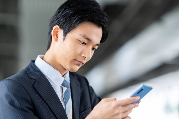 istock Businessman making a phone call in the business district 1449212751