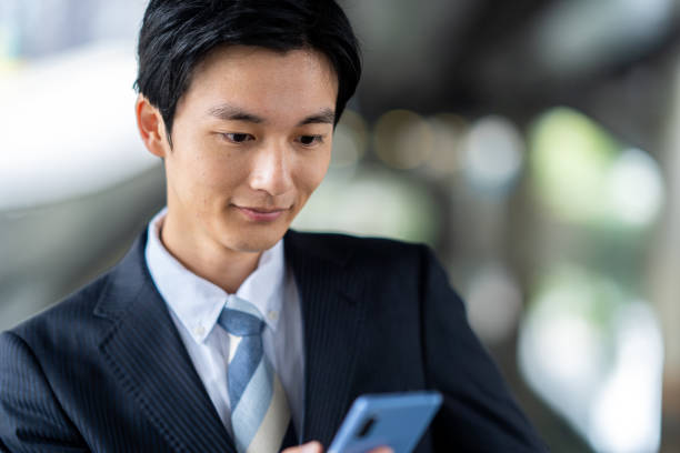 istock Businessman making a phone call in the business district 1449212945