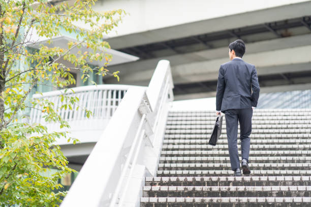 istock Businessman walking on urban stairs 1449213101