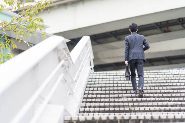 istock Businessman walking on urban stairs 1449213735