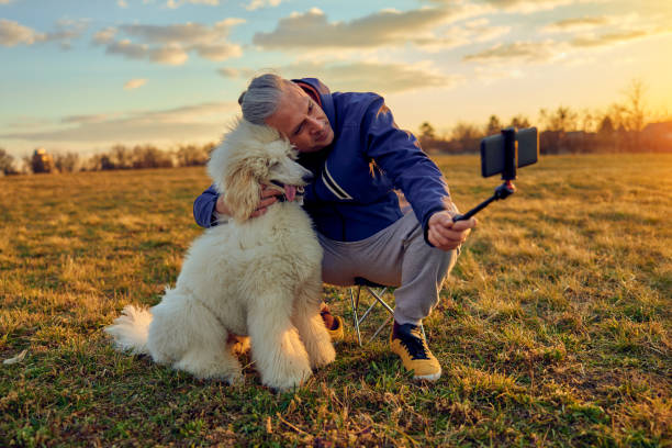istock Handsome man taking a selfie with his dog. 1449214059