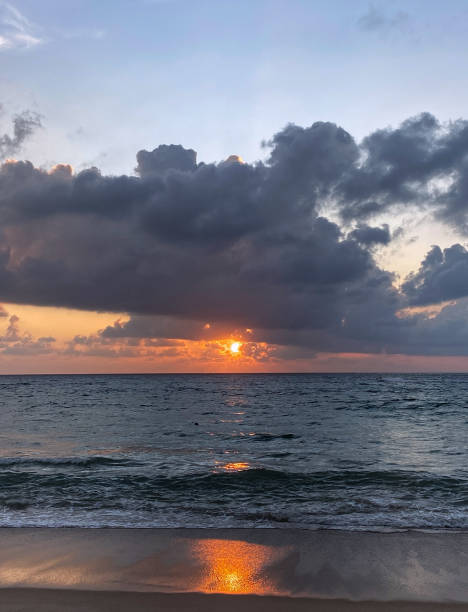 istock Beautiful orange sunset over the ocean 1449214455