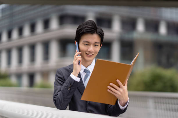 istock Businessman with file in business district 1449215748