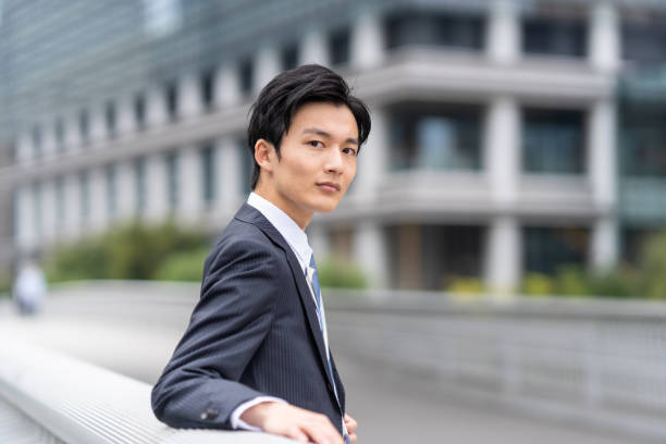 Portrait of Japanese businessman in business district stock photo