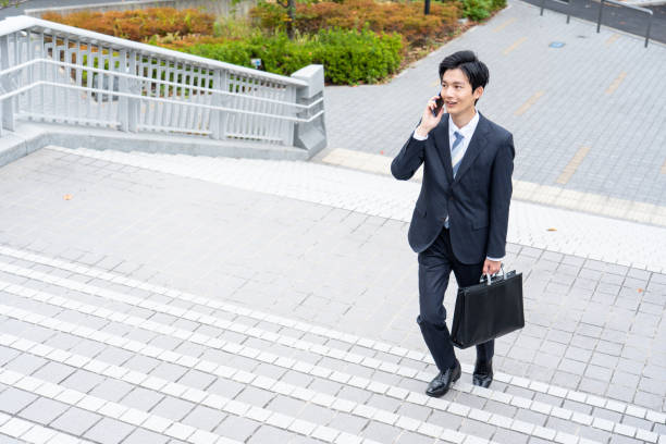 istock A man in a suit walking in the business district 1449220032