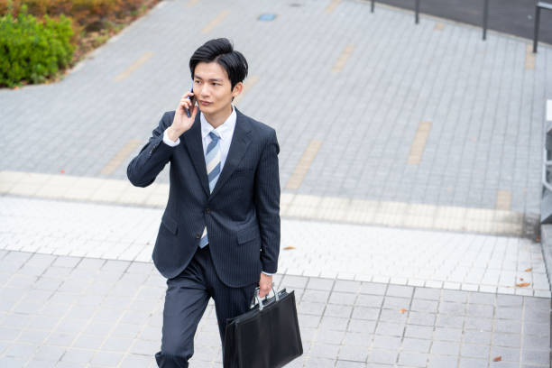 istock A man in a suit walking in the business district 1449220632