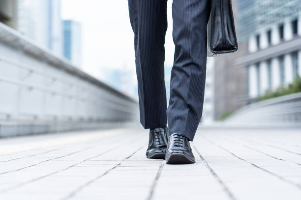 istock A man in a suit walking in the business district 1449220826