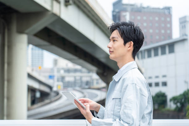 istock Men in work clothes posing in business district 1449220872