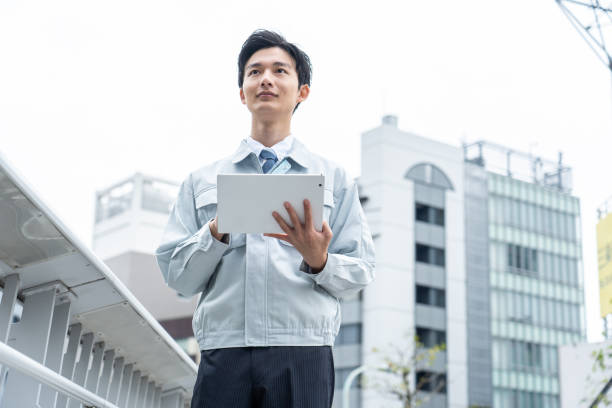 istock Men in work clothes posing in business district 1449220873