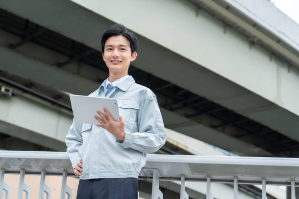 istock Men in work clothes posing in business district 1449221039