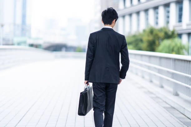 istock A man in a suit walking in the business district 1449221375