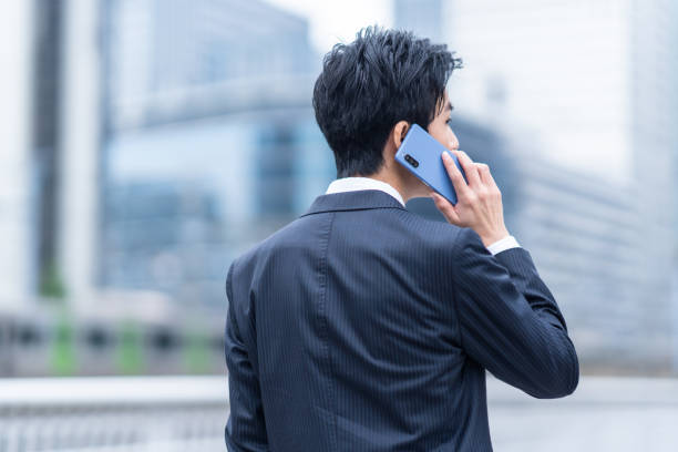 istock A man in a suit walking in the business district 1449221469