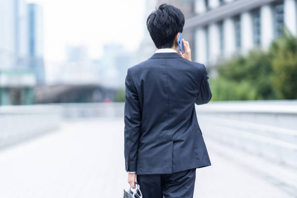 istock A man in a suit walking in the business district 1449221504