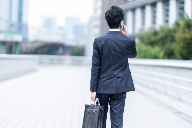istock A man in a suit walking in the business district 1449221520