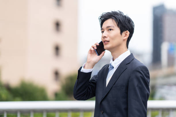 Portrait of Japanese businessman in business district stock photo