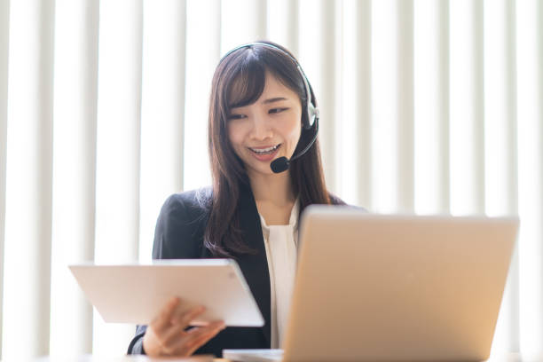 istock Woman wearing a headset and talking 1449225645