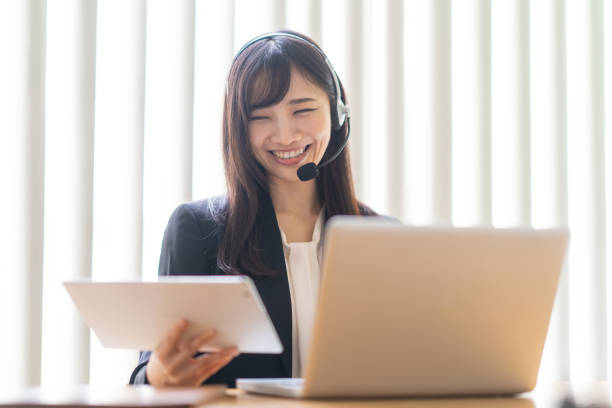 istock Woman wearing a headset and talking 1449225646