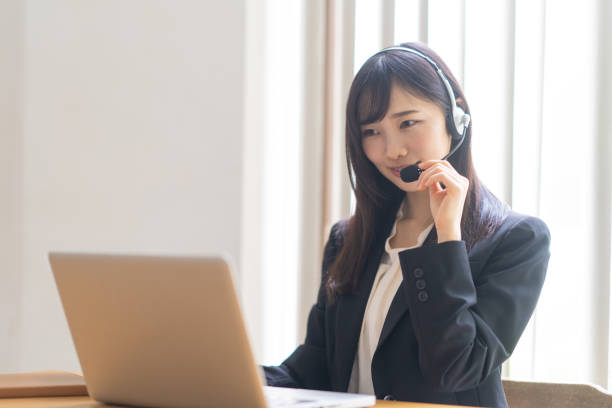 istock Woman wearing a headset and talking 1449225654