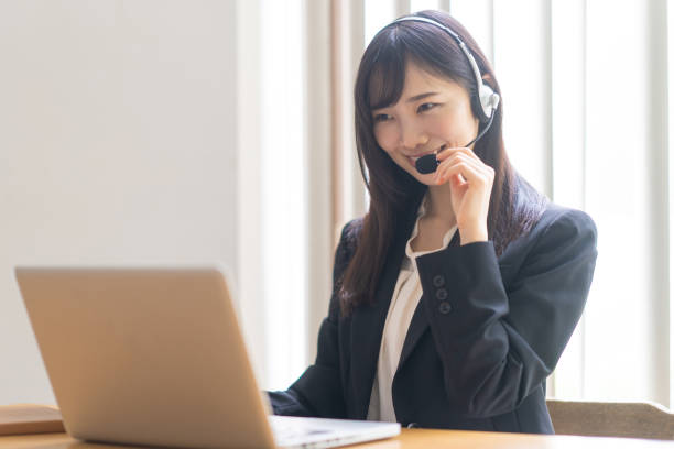 istock Woman wearing a headset and talking 1449225690