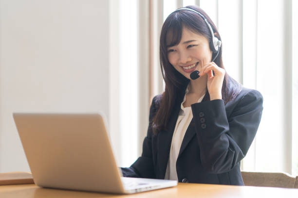 istock Woman wearing a headset and talking 1449225696